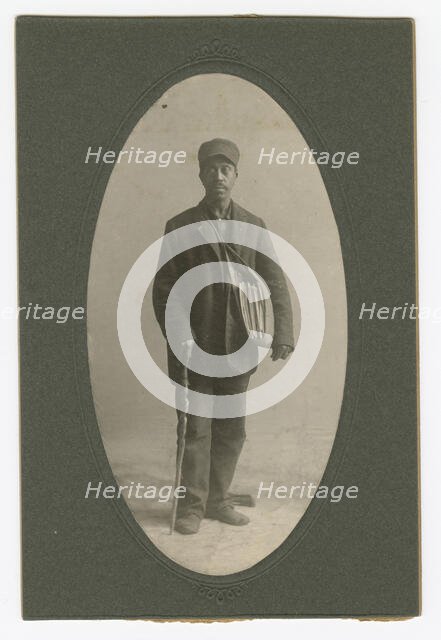 Cabinet card of a newspaper carrier, mid to late 19th century. Creator: Unknown.