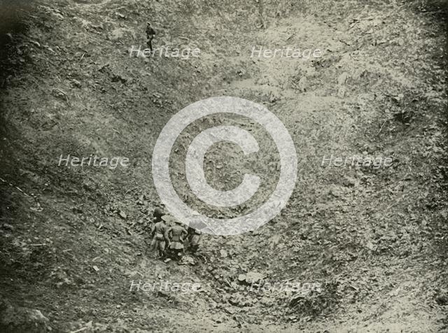 'A Mine Crater in High Wood', (1919).  Creator: Unknown.