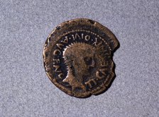 Roman coin from the first half of the first century AC, with a head facing right and the legend '…