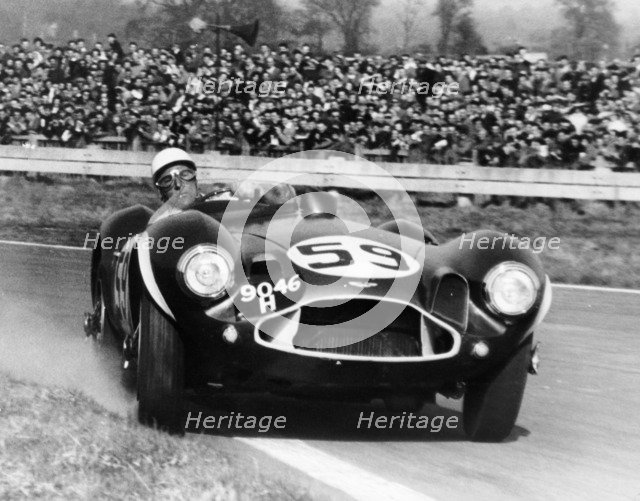 Stirling Moss diving an Aston Martin DB3S, Goodwood, West Sussex, 1956. Artist: Unknown
