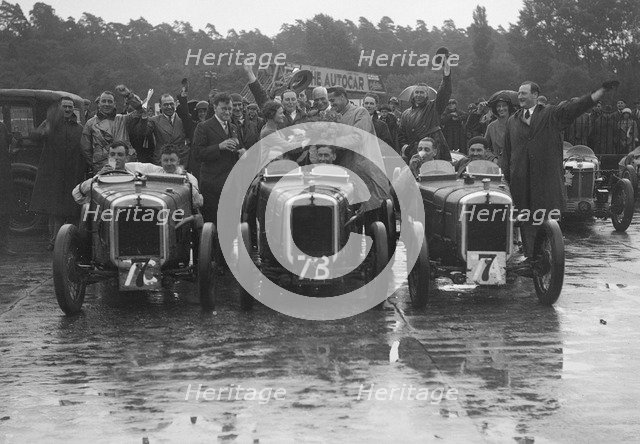 Three Austin 7 TT type Ulsters at the LCC Relay Grand Prix, Brooklands, 1931. Artist: Bill Brunell.