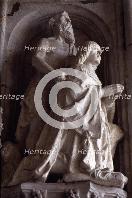 Praying statue of Don Manuel in the façade of the Jeronimos Monastery in Lisbon.