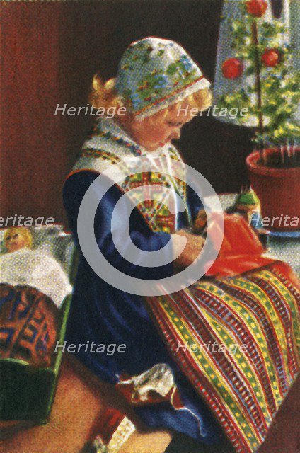 Swedish girl playing with dolls, c1928. Creator: Unknown.