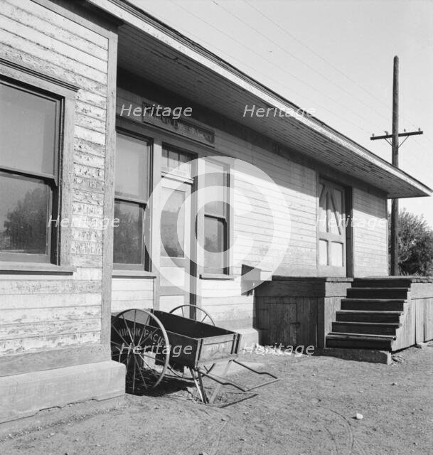 Detail of railroad station painted "railroad yellow", Irrigon, Morrow County, Oregon, 1939. Creator: Dorothea Lange.
