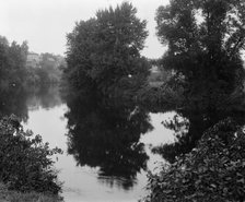 River with buildings in background, probably the Huron River, Ypsilanti, Michigan, c1900-1910. Creator: Unknown.