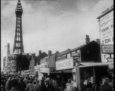 A View of Blackpool Promenade With the Blackpool Tower in the Distance and Shops and Kiosks..., 1939 Creator: British Pathe Ltd.