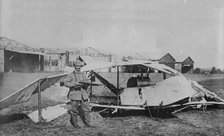 German guarding wrecked aeroplane, between 1914 and c1915. Creator: Bain News Service.