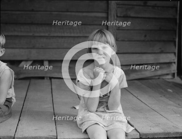 Sharecropper's child whose father receives five dollars a month, Macon County, Georgia, 1937. Creator: Dorothea Lange.