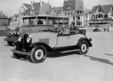 Opel open 2-seater and Laffly omnibus, Boulogne Motor Week, France, 1928. Artist: Bill Brunell.