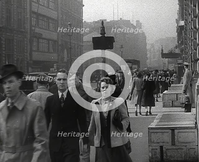 Civilians Walking Down a Street, 1942. Creator: British Pathe Ltd.
