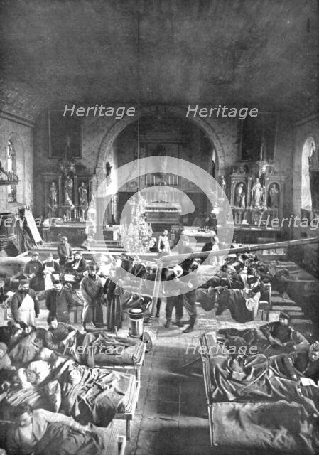 'Hors de portee de l'artillerie allemande; Une ambulance de l'avant, dans une eglise', 1915. Creator: Unknown.