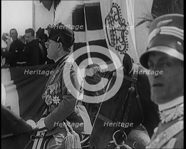 Benito Mussolini in Ceremonial Uniform on Horseback Reviewing Troops, 1926. Creator: British Pathe Ltd.