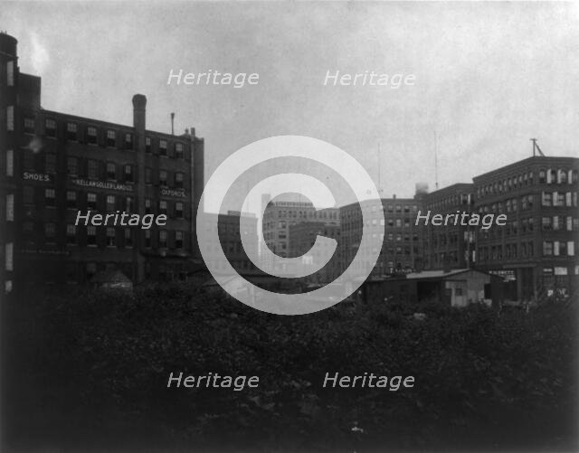 Shoe factories, Lynn, Mass.: exterior view of shoe factories and other buildings, (1895?). Creator: Frances Benjamin Johnston.