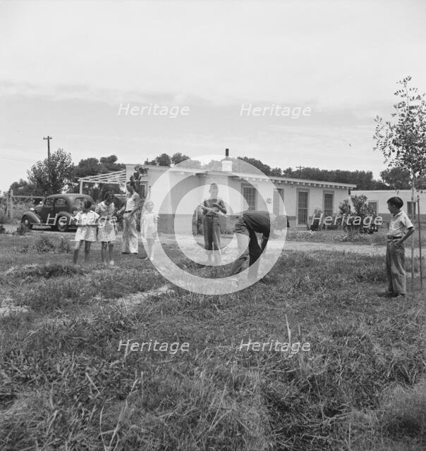 Sunday morning on the Baxter part-time farms project, Arizona, 1938. Creator: Dorothea Lange.