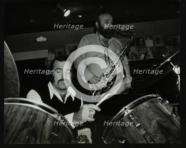 Alan Jackson (drums) and Don Weller (saxophone) playing at The Bell, Codicote, Hertfordshire, 1980. Artist: Denis Williams
