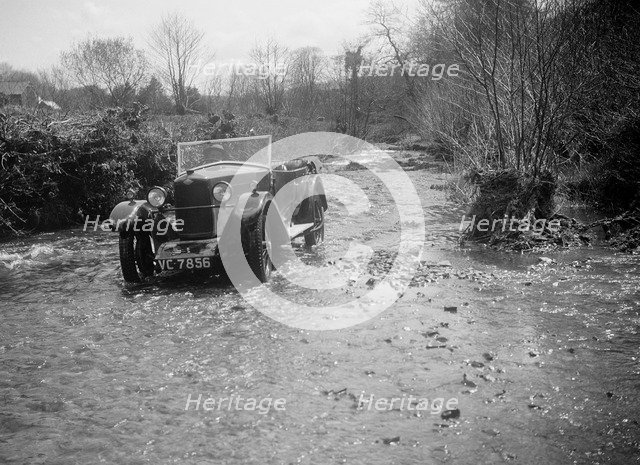 Kitty Brunell road testing a Riley 9 tourer, c1930.  Artist: Bill Brunell.