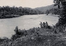 Sarawak: three men standing by the Baram River, c1900. Creator: Unknown.