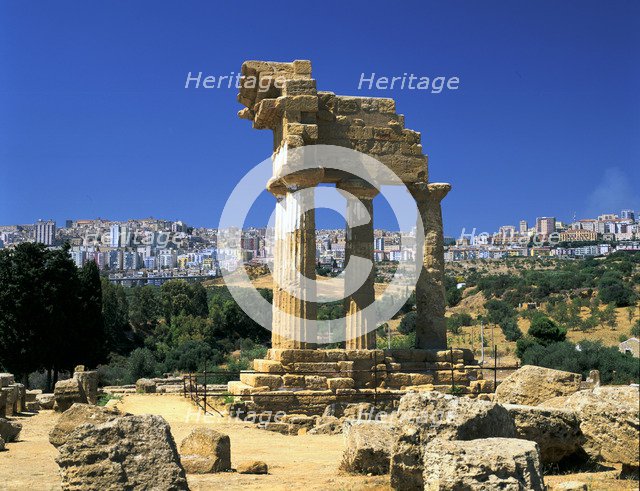 Temple of Diosuri, Agrigento, Sicily, Italy. Agrigento town behind.
