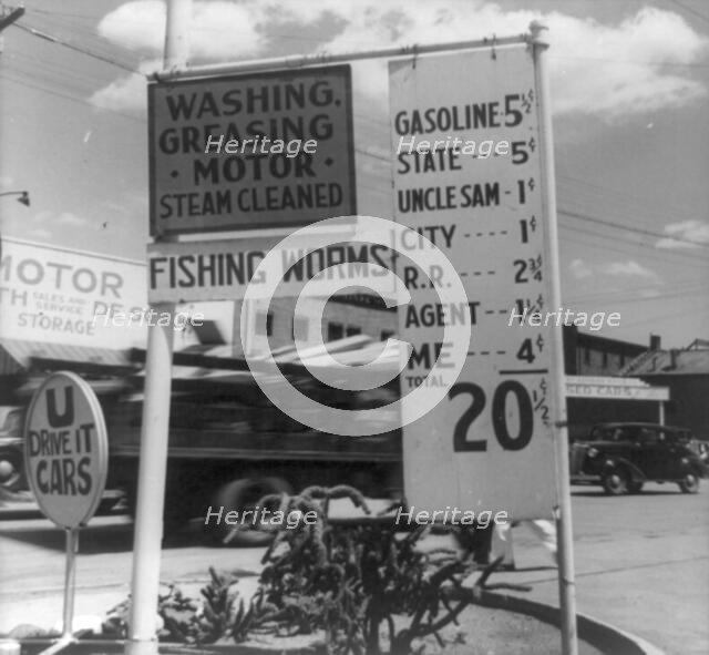 Gas station price analysis, Santa Fe, New Mexico, 1938. Creator: Dorothea Lange.