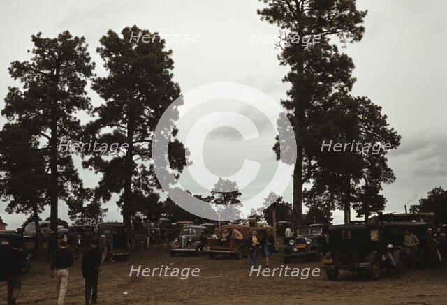 Many automobiles were parked in the grove at the Pie Town, New Mexico Fair, 1940. Creator: Russell Lee.