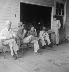 Livery stable gang talking politics...country of Senator "Cotton Ed" Smith, South Carolina, 1938. Creator: Dorothea Lange.