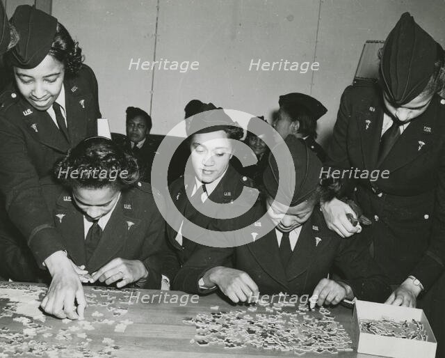 Two African American Lieutenants of the Women's Army Corps sitting at a table and..., 1939 - 1945. Creator: Unknown.