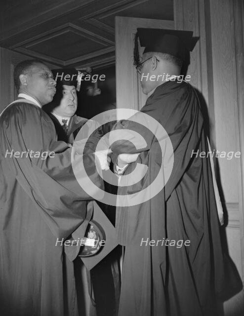Faculty members of the Howard University during commencement, Washington, D.C, 1942. Creator: Gordon Parks.