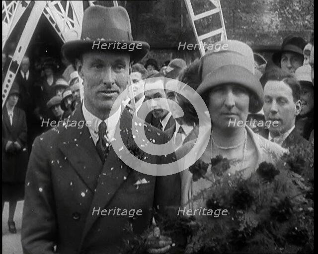 Male Civilian (Groom) And Female Civilian (Bride) Emerging from a Church To Walk Through an...,1927 Creator: British Pathe Ltd.