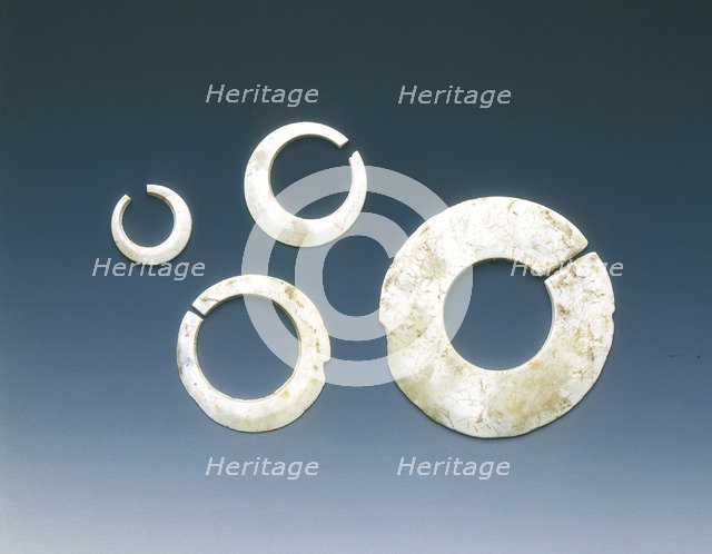 Four altered jade asymmetrical slit-discs, Neolithic, Liangzhu culture, China, c3400-2200 BC. Artist: Unknown
