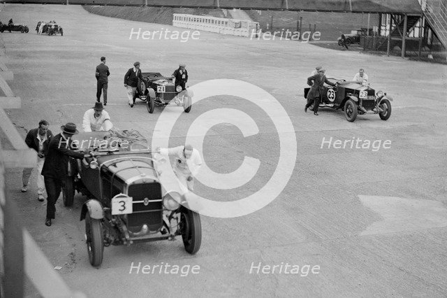 Studebaker and two OMs at the JCC Double Twelve Race, Brooklands, Surrey, 1929. Artist: Bill Brunell.