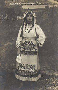 A Ukrainian prisoner of war performing a dance at a prisoner... (between 1910 and 1919?). Creator: Paul Tharan.