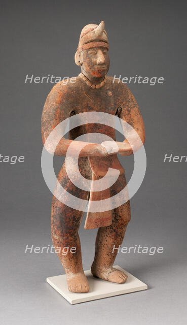 Standing Male Figure Holding a Plate, A.D. 100/400. Creator: Unknown.