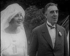 Bride and Groom Standing for Photographs, 1921. Creator: British Pathe Ltd.