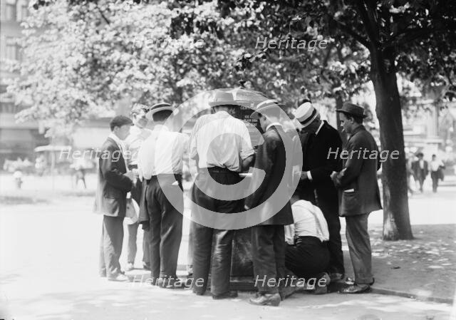 Ice water in the park--hot day, N.Y.C., between c1910 and c1915. Creator: Bain News Service.