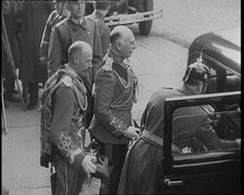 Men Waiting by a Car, 1930s. Creator: British Pathe Ltd.