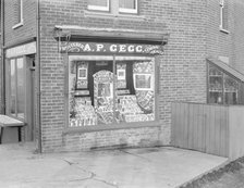 Decorated shop window of AP Gegg, c1935. Creator: Kirk & Sons of Cowes.