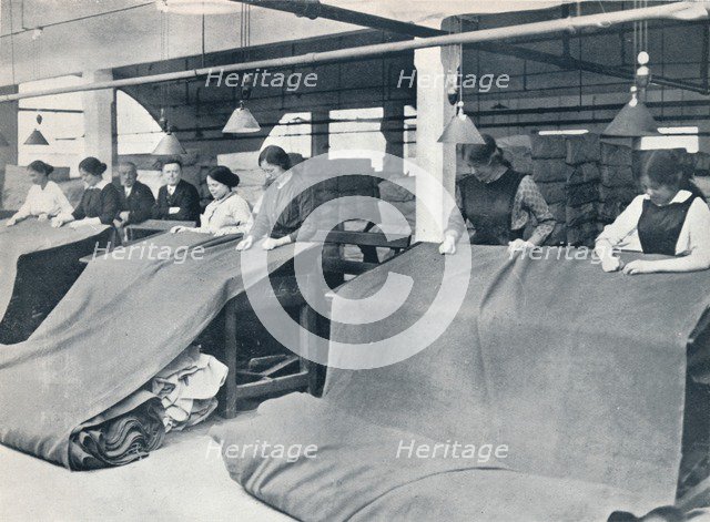 The Making of khaki: examining the finished cloth, c1914.