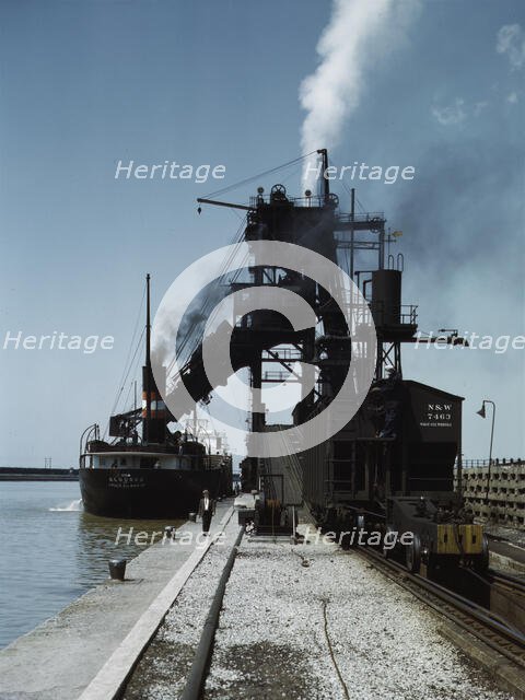 Loading a lake freighter with coal at the Pennsylvania R.R. coal docks...Sandusky, Ohio, 1943. Creator: Jack Delano.