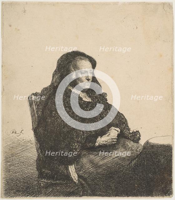 The Artist's Mother Seated at a Table Looking Right: Three-Quarter Length, ca. 1631. Creator: Rembrandt Harmensz van Rijn.