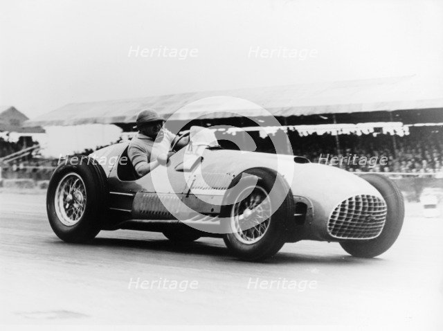 Froilan Gonzalez driving a Ferrari, early 1950s. Artist: Unknown