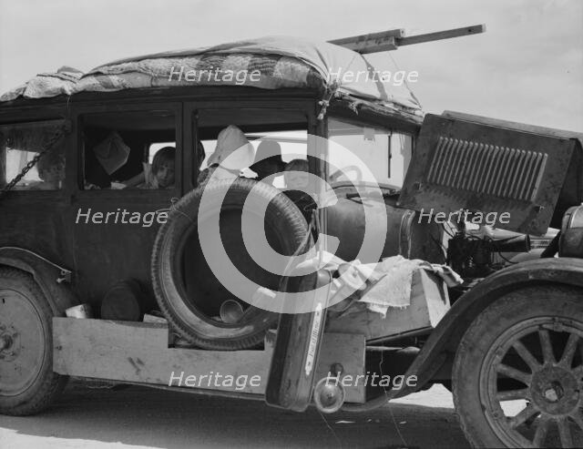 Migrant drought refugee family stalled on an Arizona highway, between Yuma and Phoenix, 1937. Creator: Dorothea Lange.