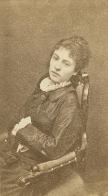 Three-quarter length portrait of woman, seated in chair, facing left, between 1880 and 1886. Creator: Unknown.