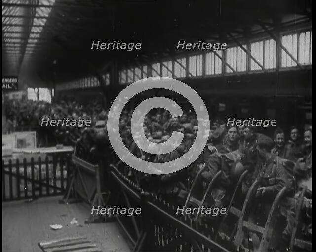 Male Members of the British Expeditionary Force Waiting at  a Large Railway Station Before..., 1939. Creator: British Pathe Ltd.