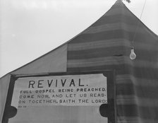 Revival meetings are held in Yakima shacktown, Sumac Park, Yakima, Washington , 1939. Creator: Dorothea Lange.