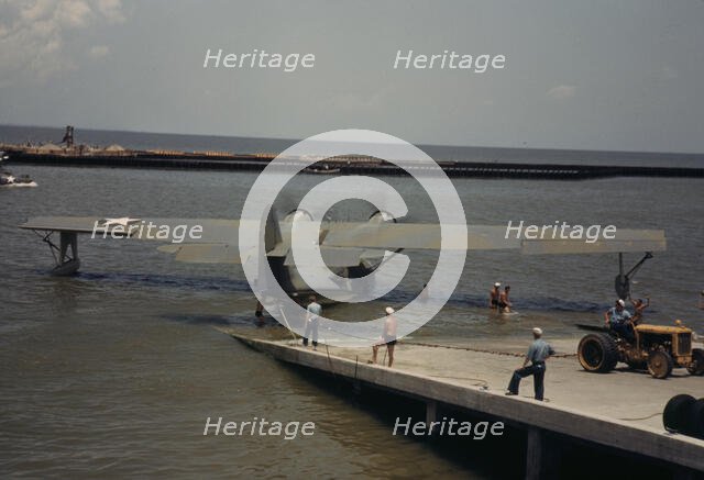 Working with a sea-plane at the Naval Air Base, Corpus Christi, Texas, 1942. Creator: Howard Hollem.