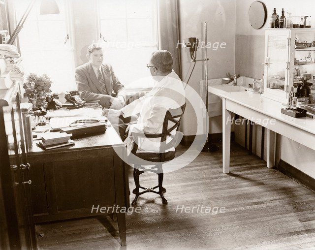 A man consults a Rowntree doctor in his surgery, York, Yorkshire, 1955. Artist: Unknown