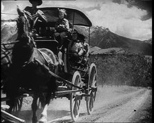 Coach and Horses Picking up Passengers Arriving Off the Train And Driving Through the Prairie, 1932. Creator: British Pathe Ltd.