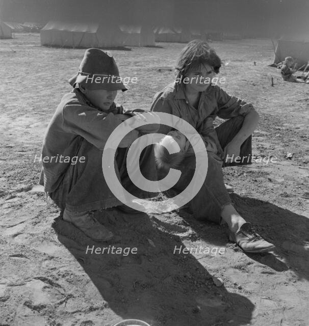 Young Oklahoma mother, age eighteen, penniless, stranded in California, Imperial Valley, 1937. Creator: Dorothea Lange.