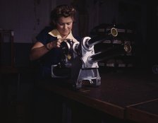 A young woman employee of North American Aviation, Incorporated..., Inglewood, Calif. , 1942. Creator: Alfred T Palmer.