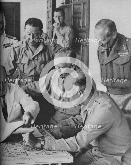 'Council of War in Algiers: Mr Churchill with his Captains', 1943. Artist: Unknown.